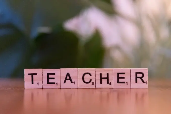 A wooden block spelling out the word teacher